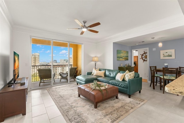 living room featuring ceiling fan, light tile patterned floors, and ornamental molding