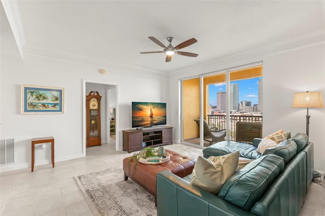 tiled living room featuring ornamental molding and ceiling fan