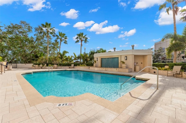 view of swimming pool with a patio area