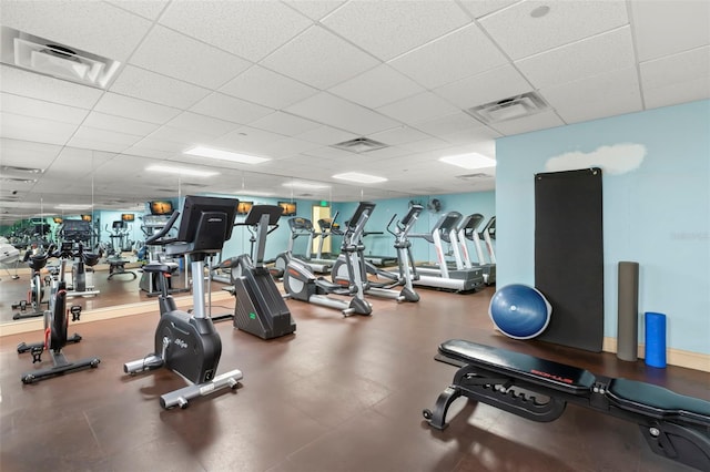 exercise room featuring a paneled ceiling