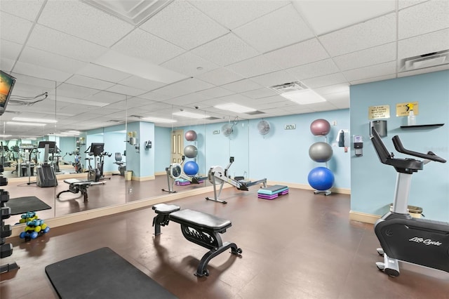 exercise room with a drop ceiling