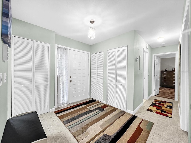 foyer entrance featuring light tile patterned floors