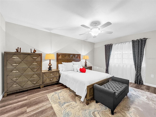 2920 Star Apple Ct, Palm Harbor, FL 34684 - bedroom with wood finished floors, ceiling fan, and baseboards