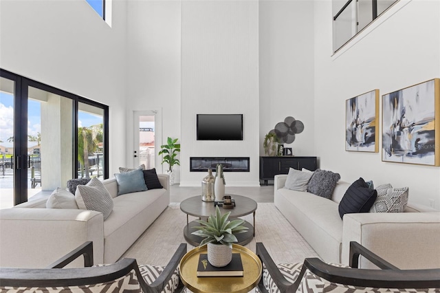 living room featuring french doors and a high ceiling