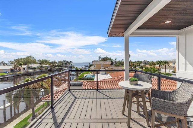 wooden deck with a water view