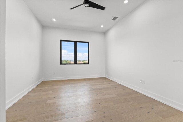 unfurnished room featuring ceiling fan and light hardwood / wood-style floors