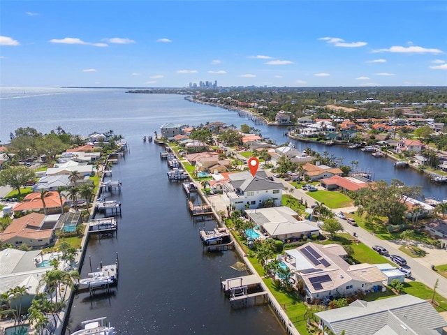 birds eye view of property with a residential view and a water view