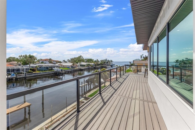 balcony featuring a water view