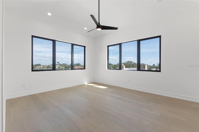 unfurnished room featuring recessed lighting, baseboards, light wood finished floors, and ceiling fan