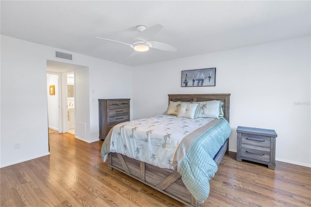 bedroom featuring hardwood / wood-style flooring and ceiling fan