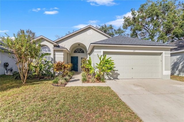 single story home with a garage and a front lawn