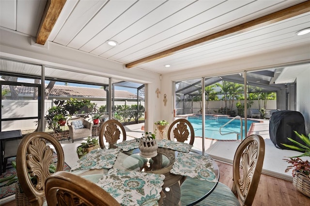 sunroom with beamed ceiling