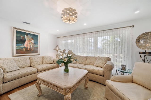 living area featuring wood finished floors, visible vents, and recessed lighting