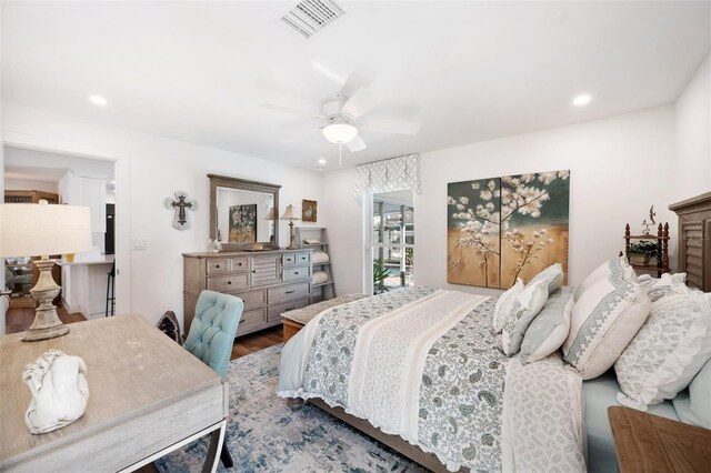 bedroom with a ceiling fan, visible vents, wood finished floors, and recessed lighting