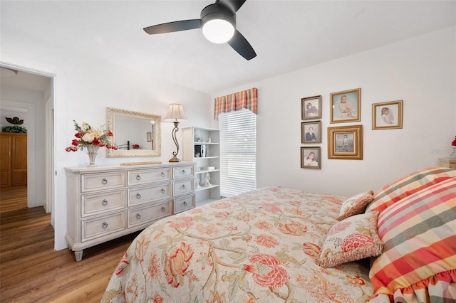 bedroom featuring ceiling fan and wood finished floors