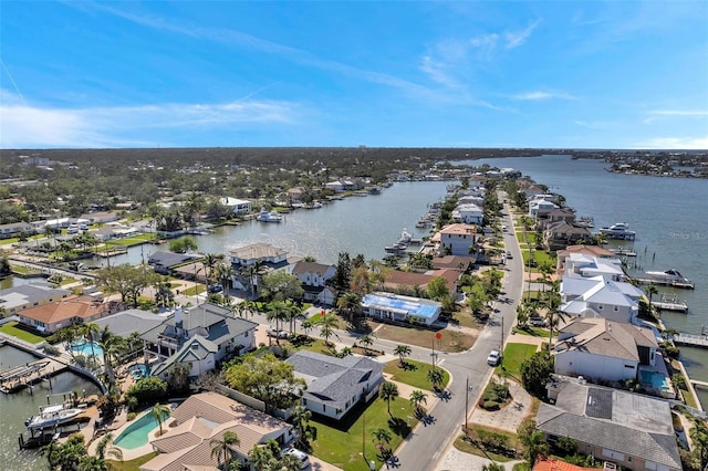 birds eye view of property with a residential view and a water view