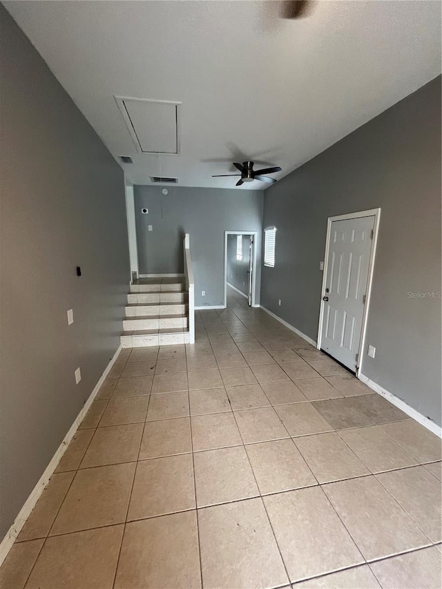 interior space featuring lofted ceiling and ceiling fan