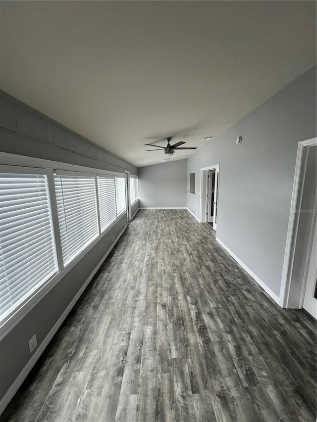 interior space featuring lofted ceiling and ceiling fan