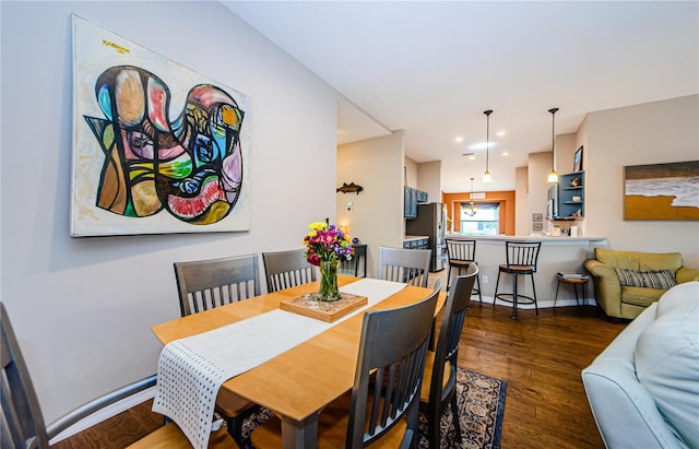 dining room with dark hardwood / wood-style floors