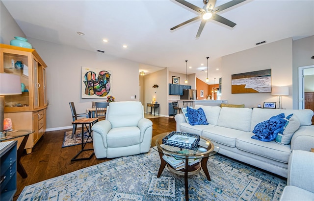 living room with dark hardwood / wood-style floors and ceiling fan