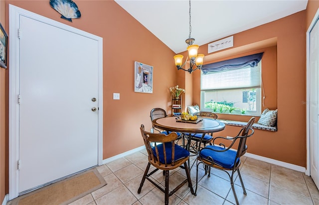 tiled dining area with an inviting chandelier and vaulted ceiling