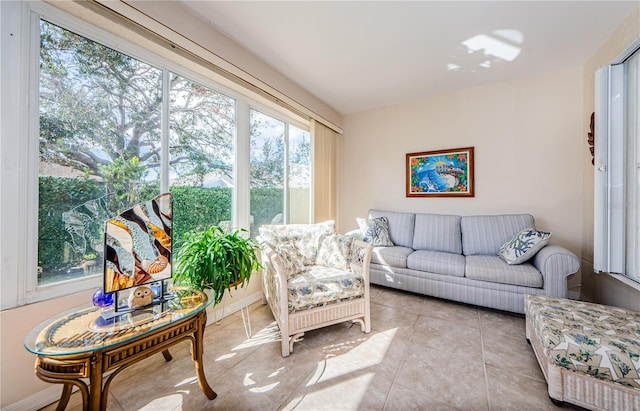 tiled living room with plenty of natural light