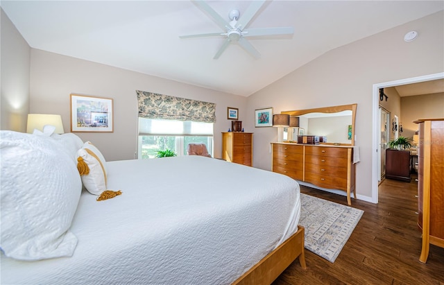 bedroom featuring dark wood-type flooring, ceiling fan, and vaulted ceiling