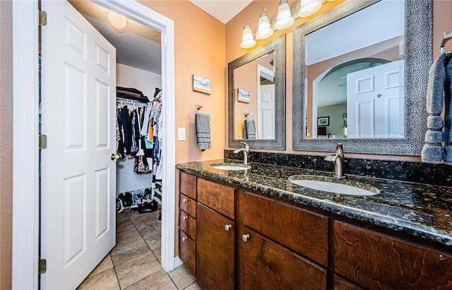 bathroom with tile patterned flooring and vanity