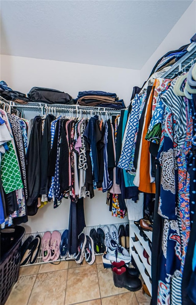 spacious closet featuring tile patterned floors