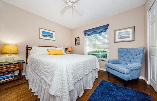 bedroom with dark wood-type flooring and ceiling fan