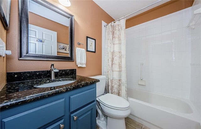 full bathroom with shower / bath combo with shower curtain, tile patterned floors, vanity, and toilet