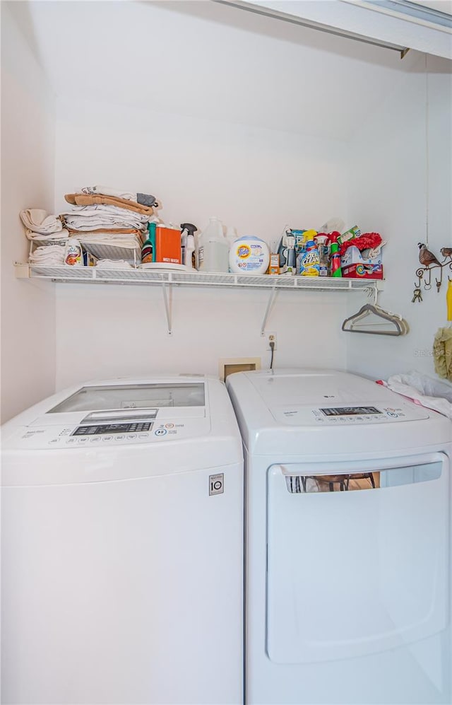 clothes washing area featuring washing machine and dryer