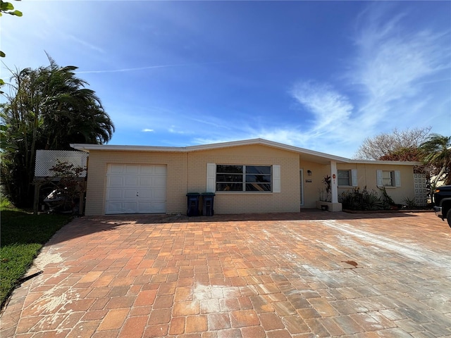 single story home with a garage