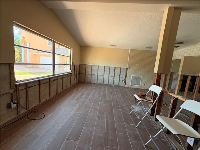 unfurnished room with dark wood-type flooring