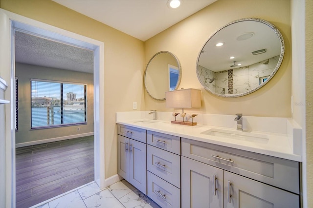 bathroom featuring vanity, hardwood / wood-style flooring, and walk in shower