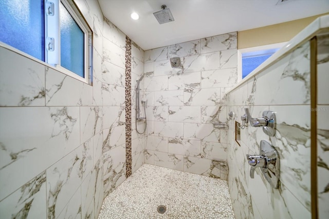 bathroom featuring tiled shower