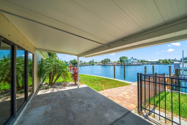 view of patio with a water view