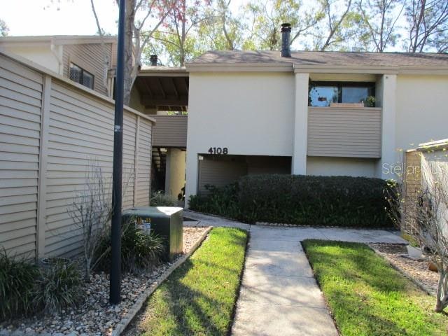 exterior space featuring a carport