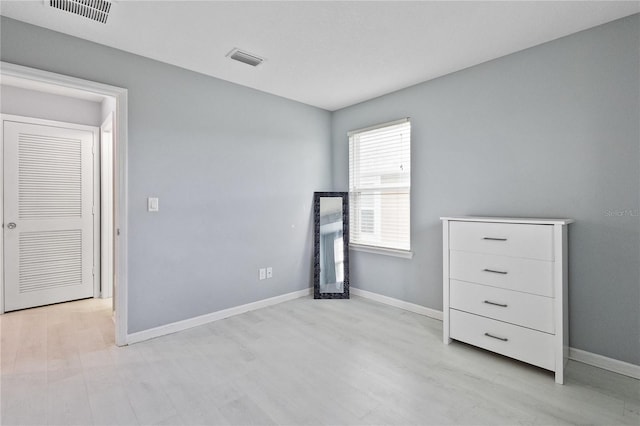 unfurnished room featuring light wood-type flooring