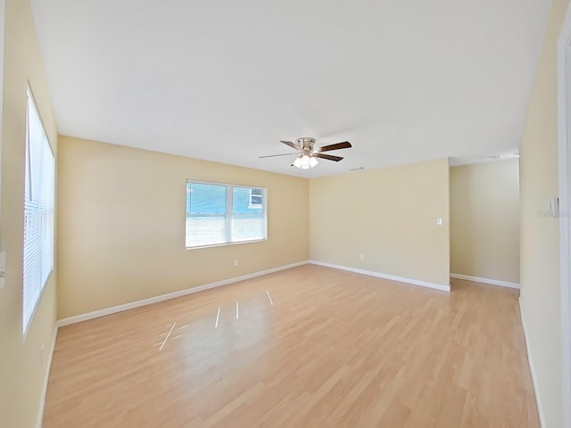 spare room featuring light hardwood / wood-style floors and ceiling fan