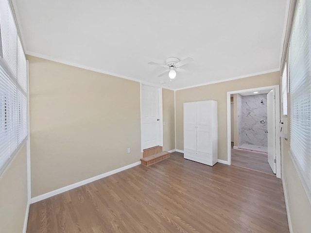 unfurnished bedroom with wood-type flooring, ceiling fan, and ornamental molding