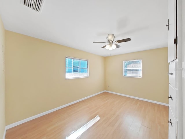 unfurnished room featuring light hardwood / wood-style flooring and ceiling fan