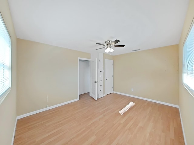 unfurnished bedroom with ceiling fan and light hardwood / wood-style floors