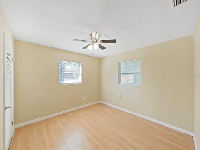 empty room featuring light hardwood / wood-style flooring and ceiling fan