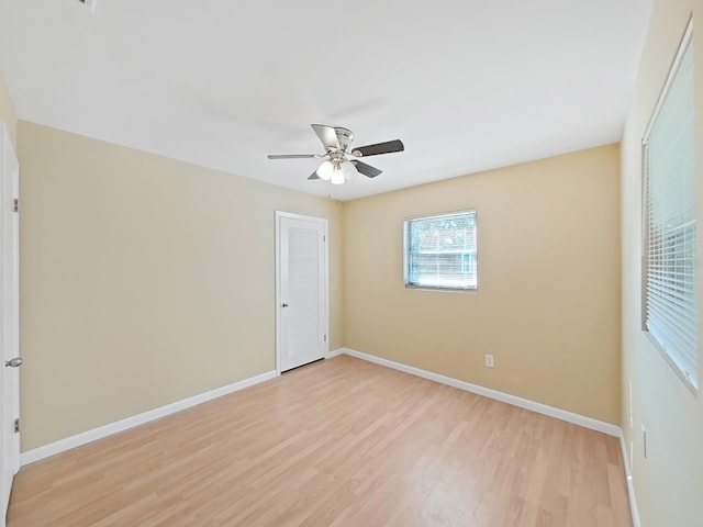 spare room featuring ceiling fan and light hardwood / wood-style floors