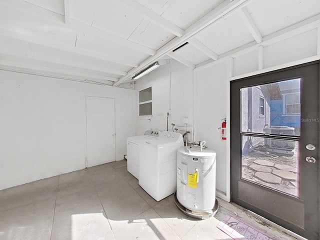 laundry area featuring washing machine and dryer and water heater