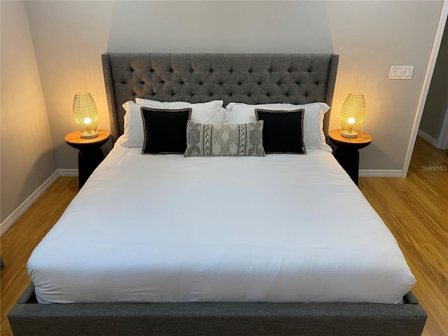 bedroom featuring hardwood / wood-style flooring