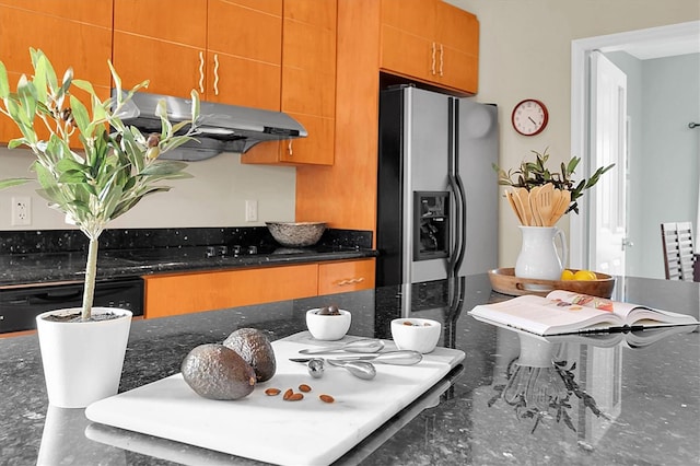 kitchen featuring ventilation hood, dishwashing machine, dark stone countertops, and stainless steel fridge with ice dispenser