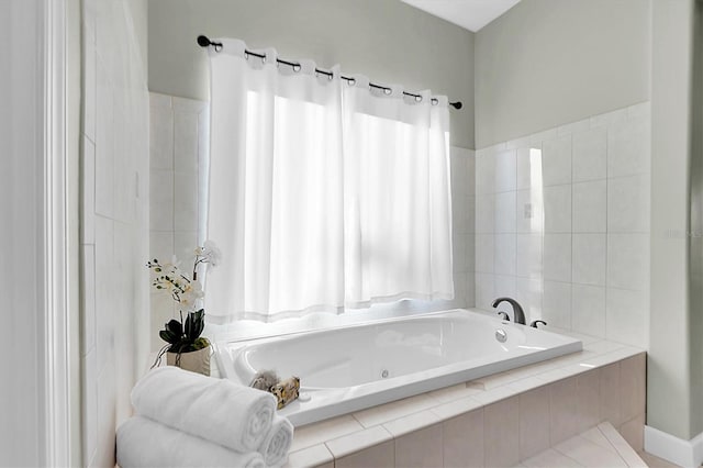 bathroom with tiled tub