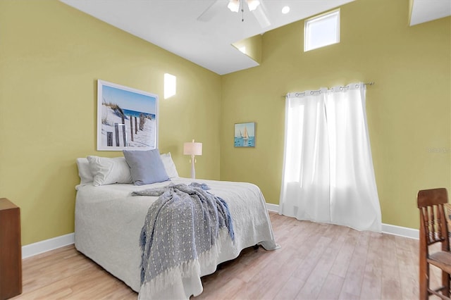 bedroom featuring light hardwood / wood-style floors and ceiling fan